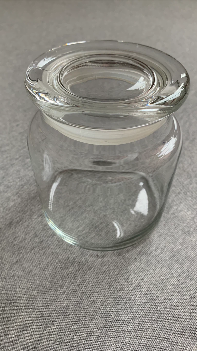 Clear glass storage jar with lid