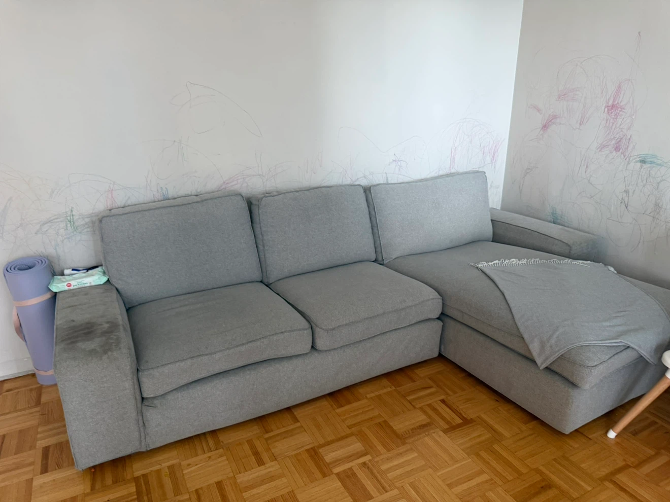 Light grey sectional sofa with right-hand chaise