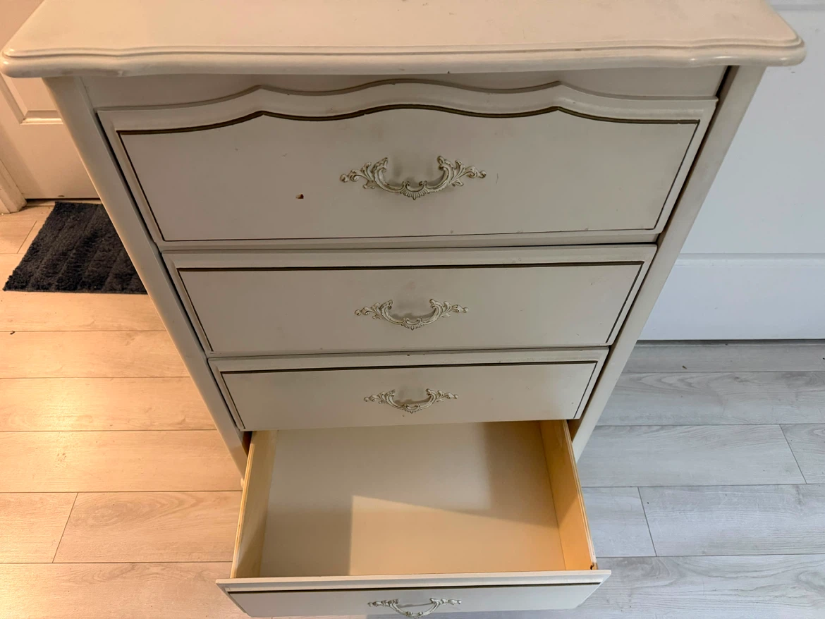 Cream dresser with ornate drawer pulls