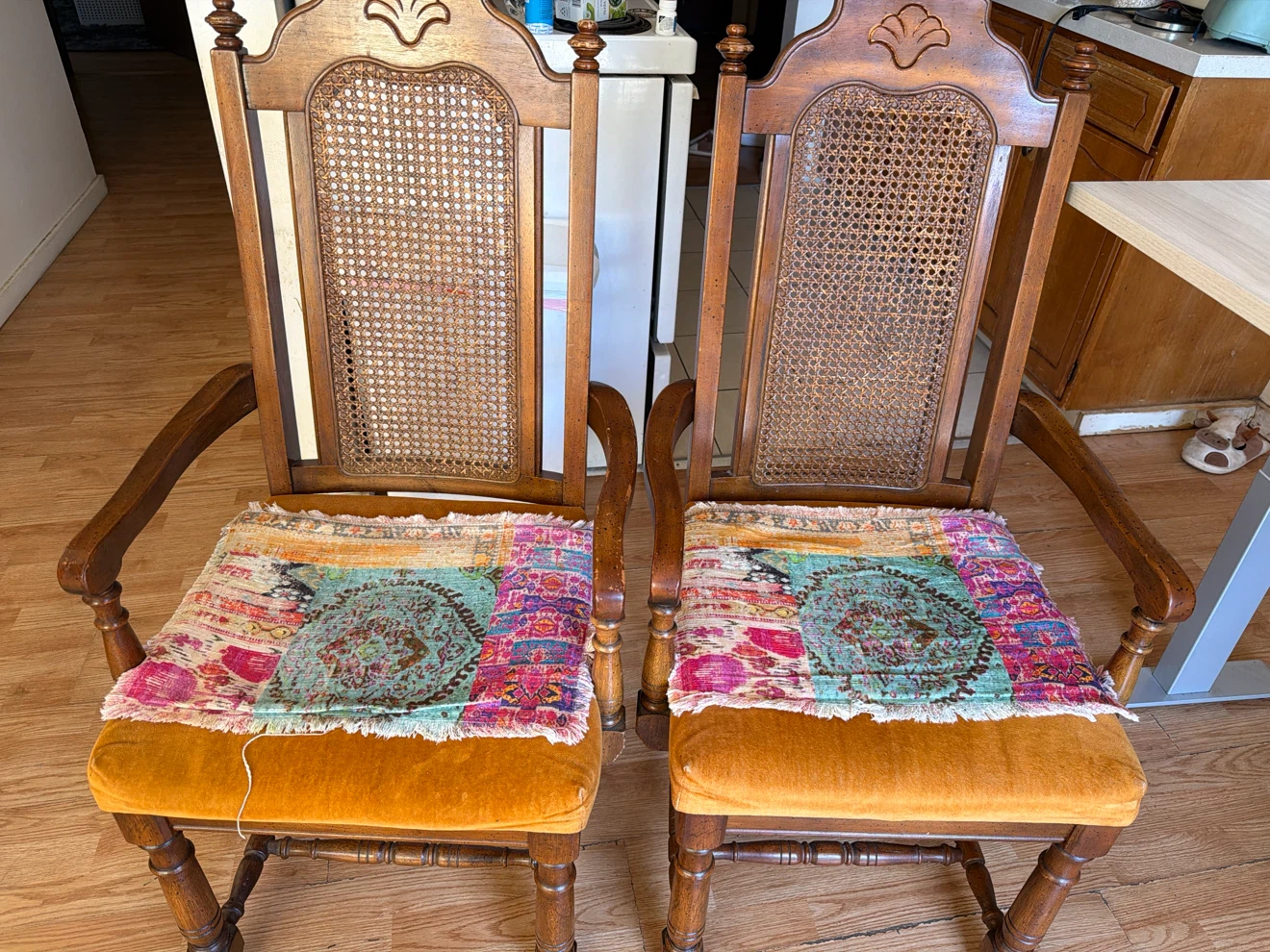 Set of two vintage wooden cane back armchairs