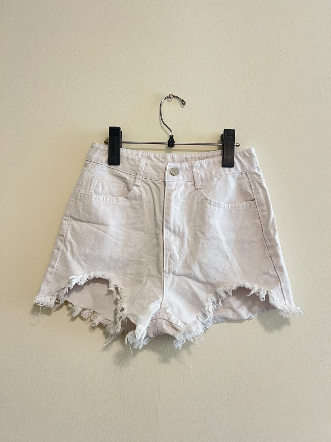 White denim shorts with frayed hem