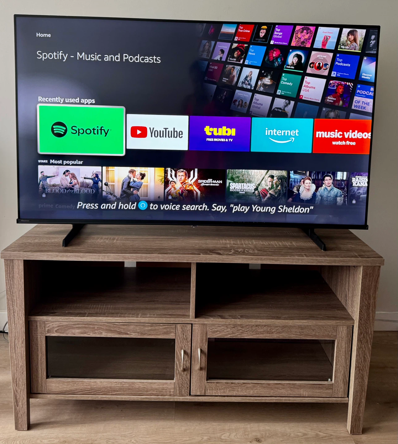 Wooden TV stand with glass doors and Hisense 55 4KQLED tv