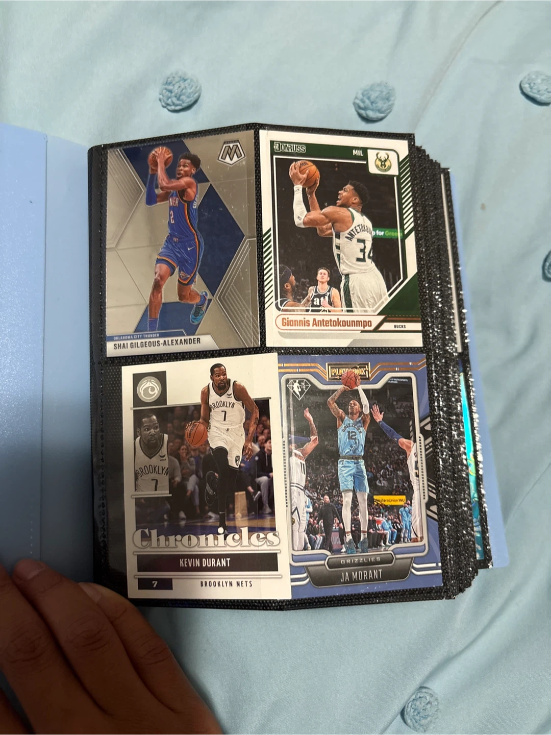Panini NBA trading card collection in blue binder
