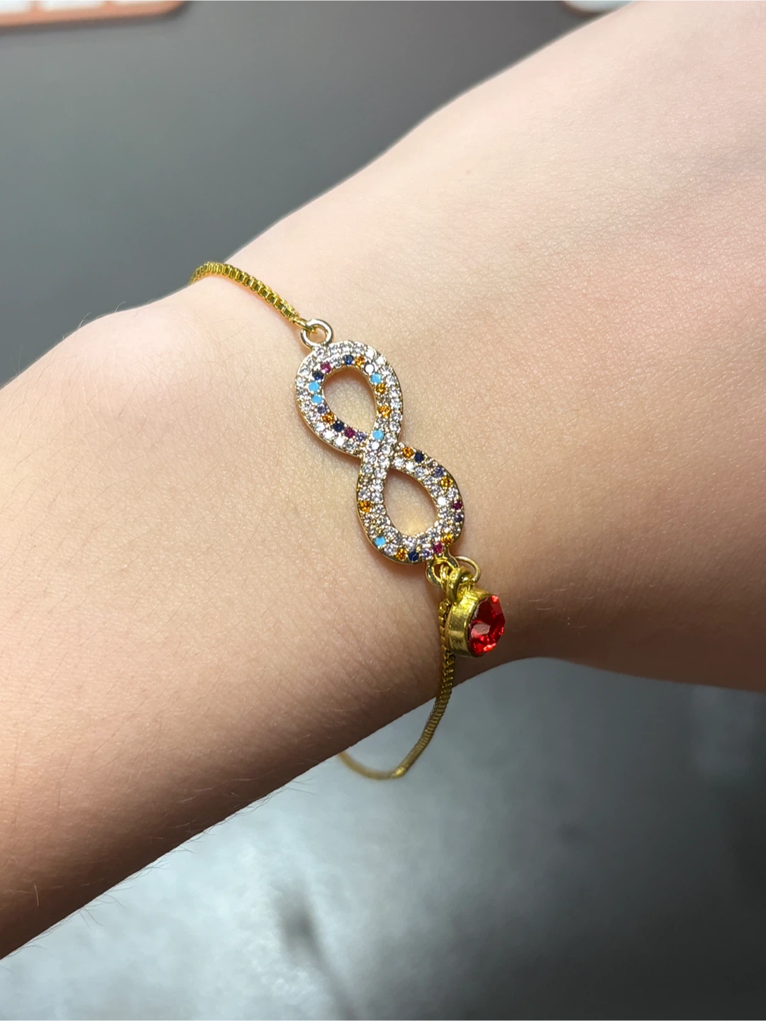 Gold Infinity Bracelet with Multicoloured Gems