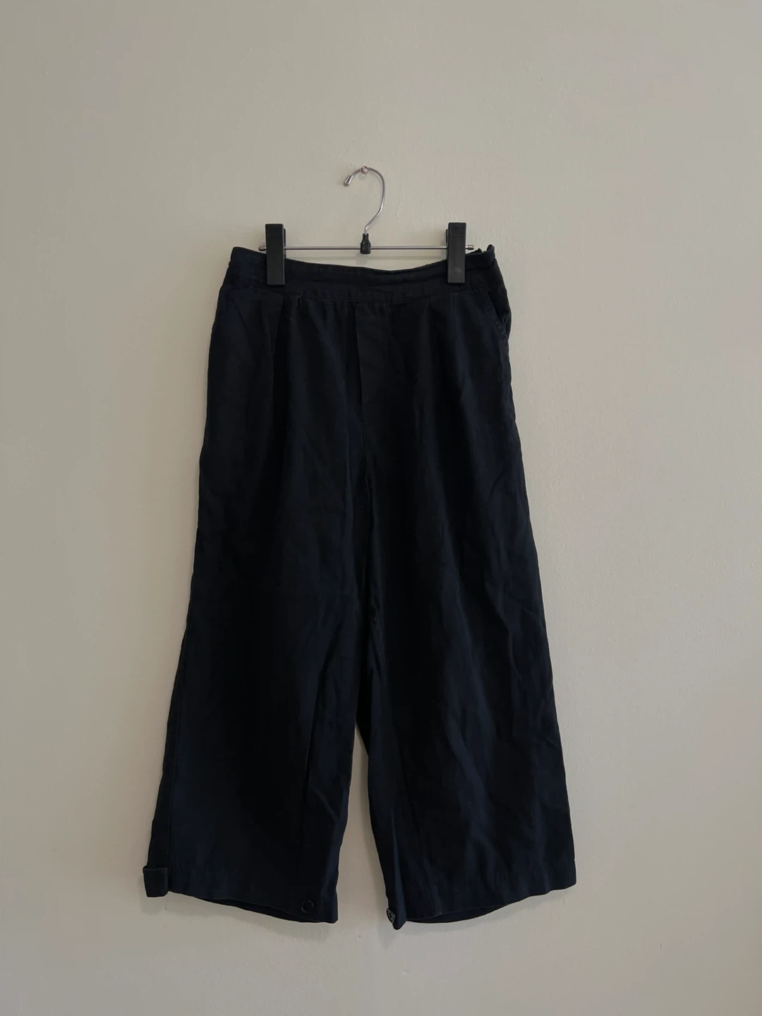 Black wide leg pleated trousers