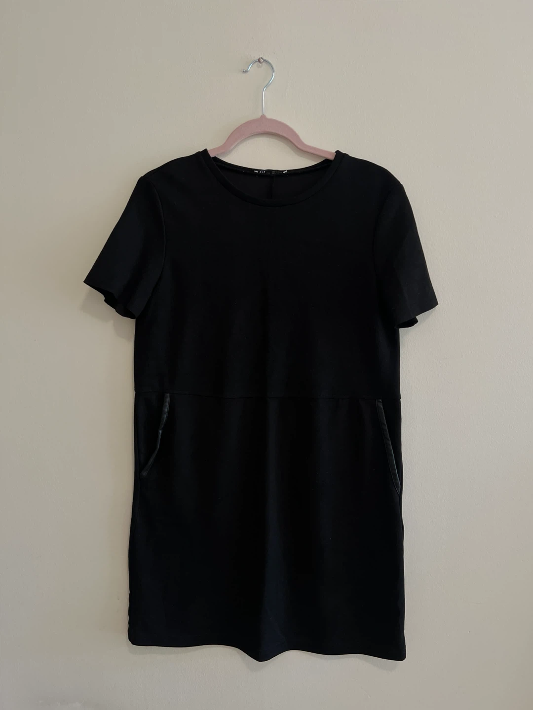 Black short sleeve dress with leather trim pockets
