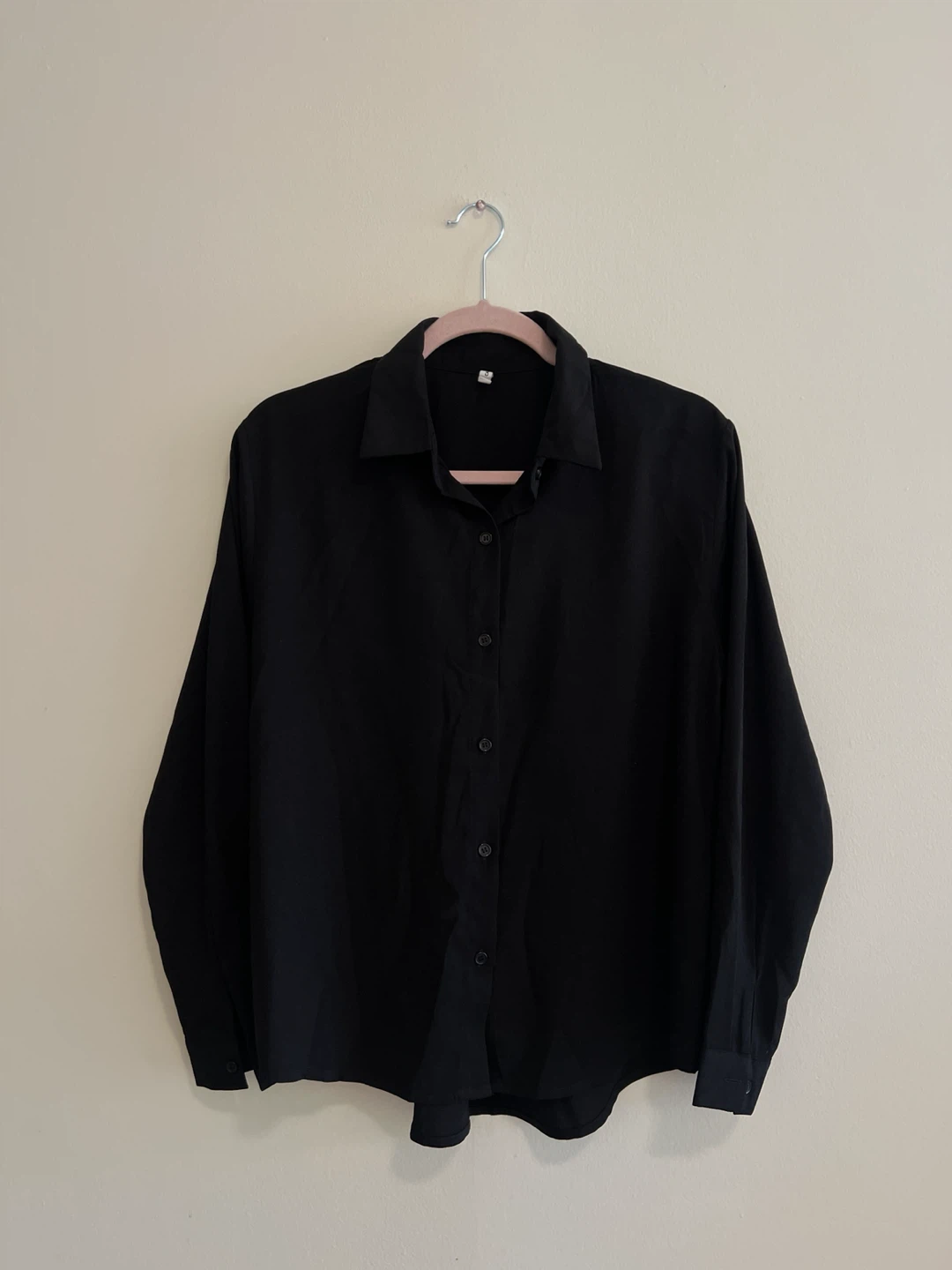 Long-sleeved black button-up shirt