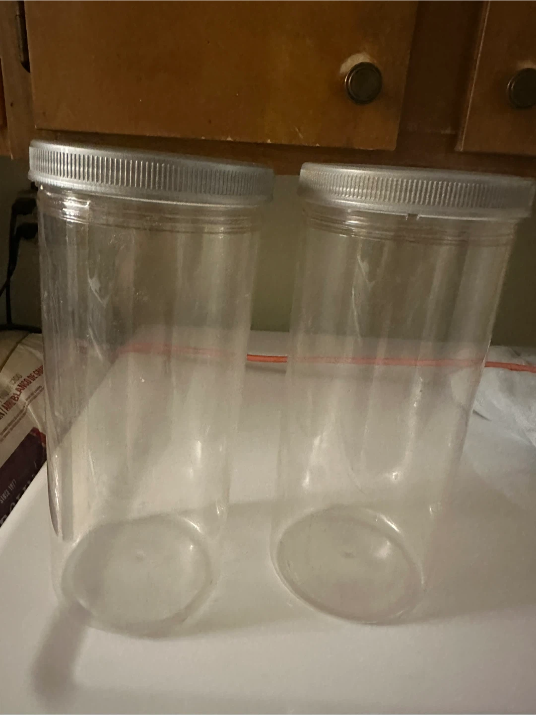Set of 2 Clear Plastic Storage Jars with Lids