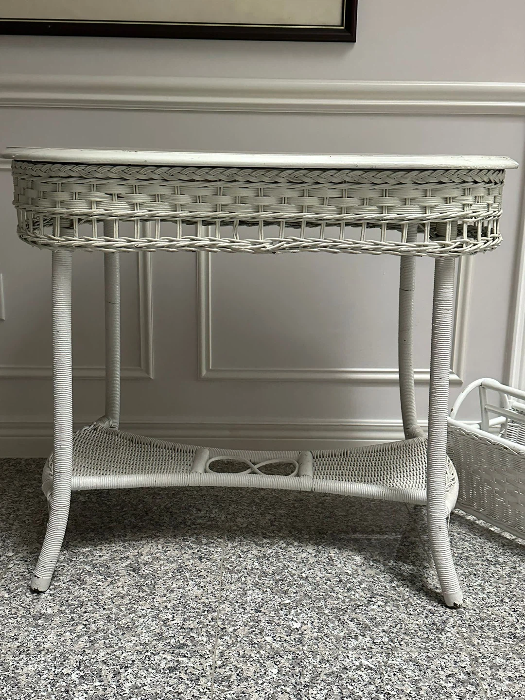 White wicker console table with matching magazine rack