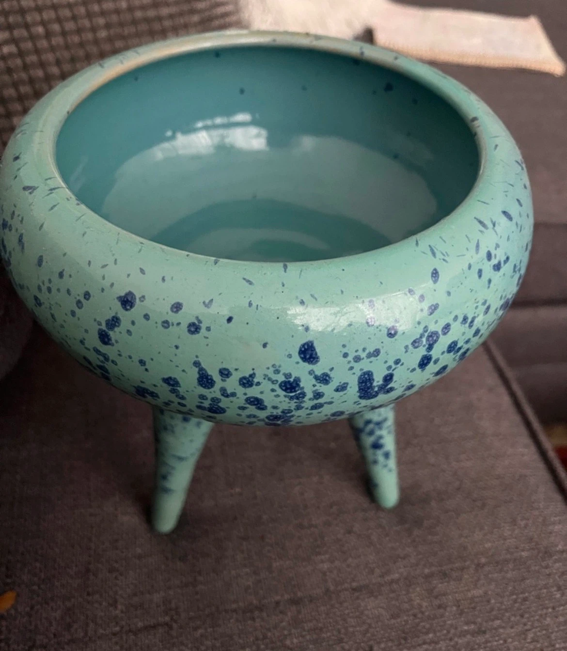 Teal speckled ceramic planter with legs
