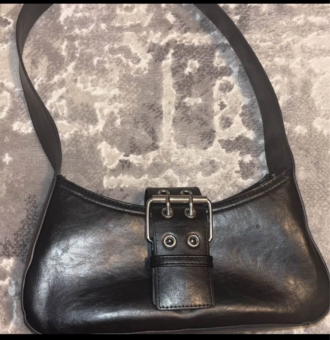 Black shoulder bag with buckle detail