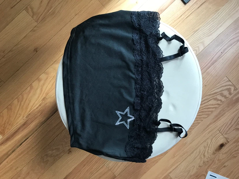 Black camisole with lace trim and star detail