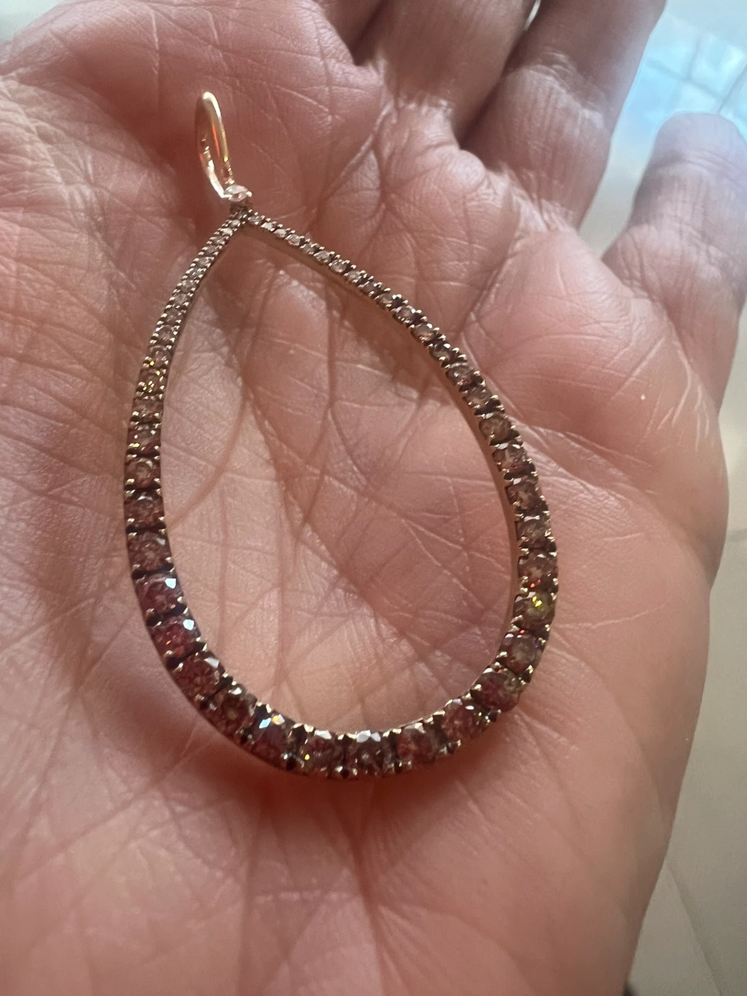 14 k Teardrop  diamond pendant .