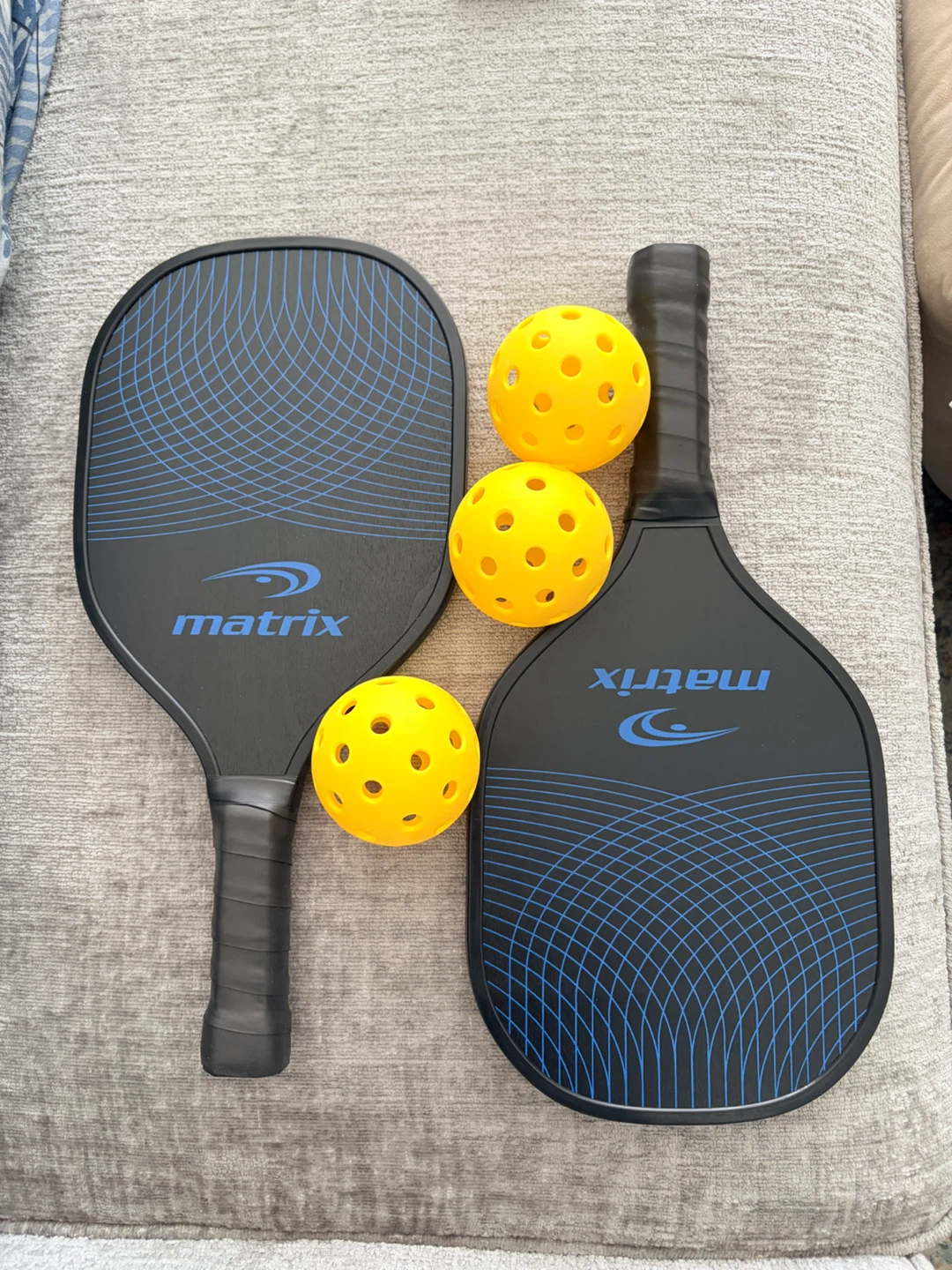 Pickleball paddles and 3 balls