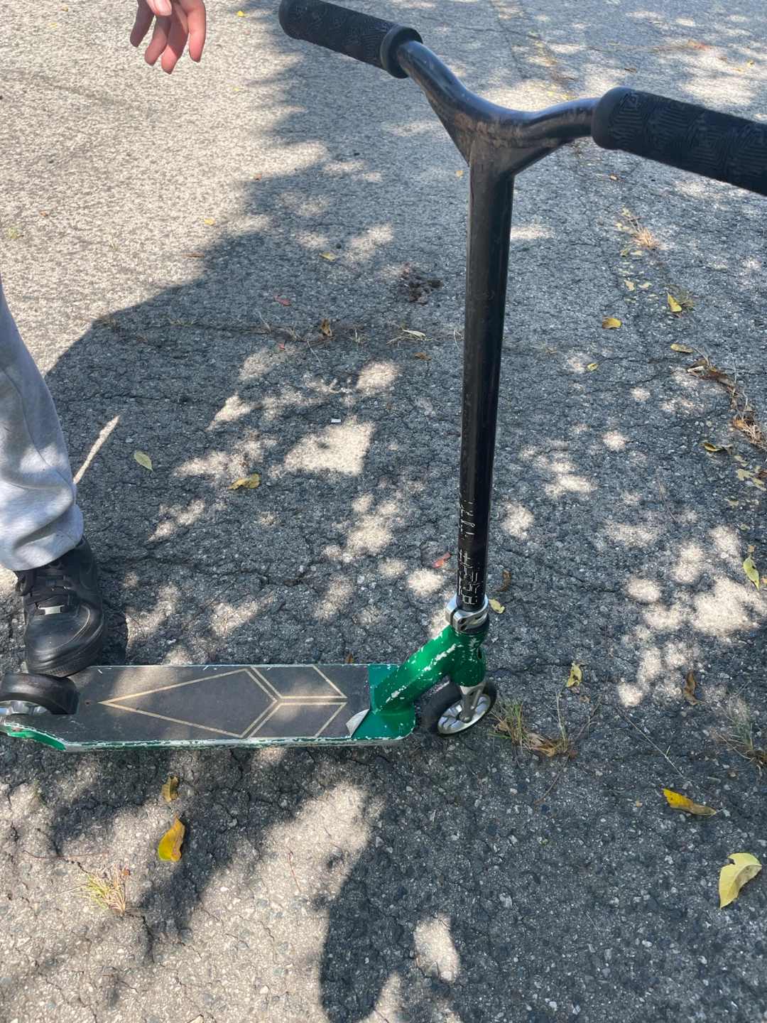 Green and black stunt scooter for kids