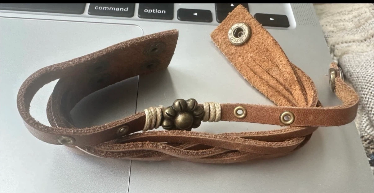 Tan leather wrap bracelet with flower charm