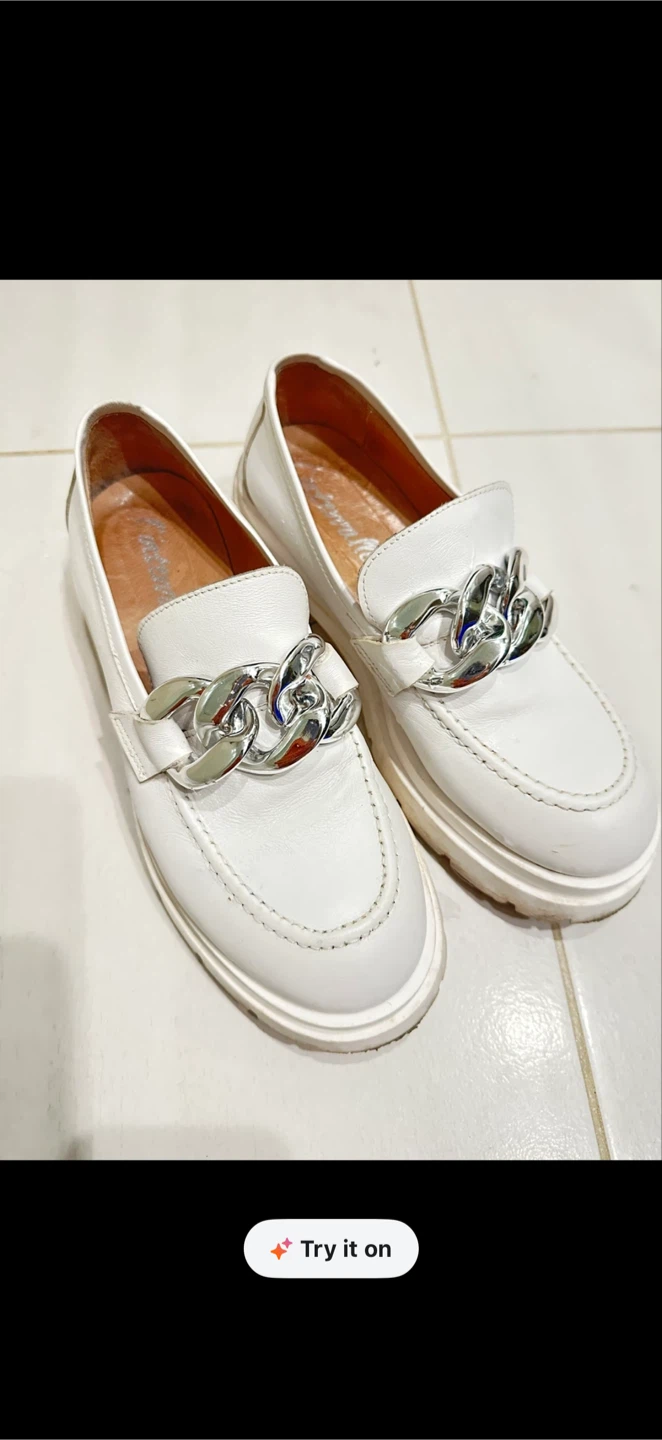 White leather platform loafers with silver chain