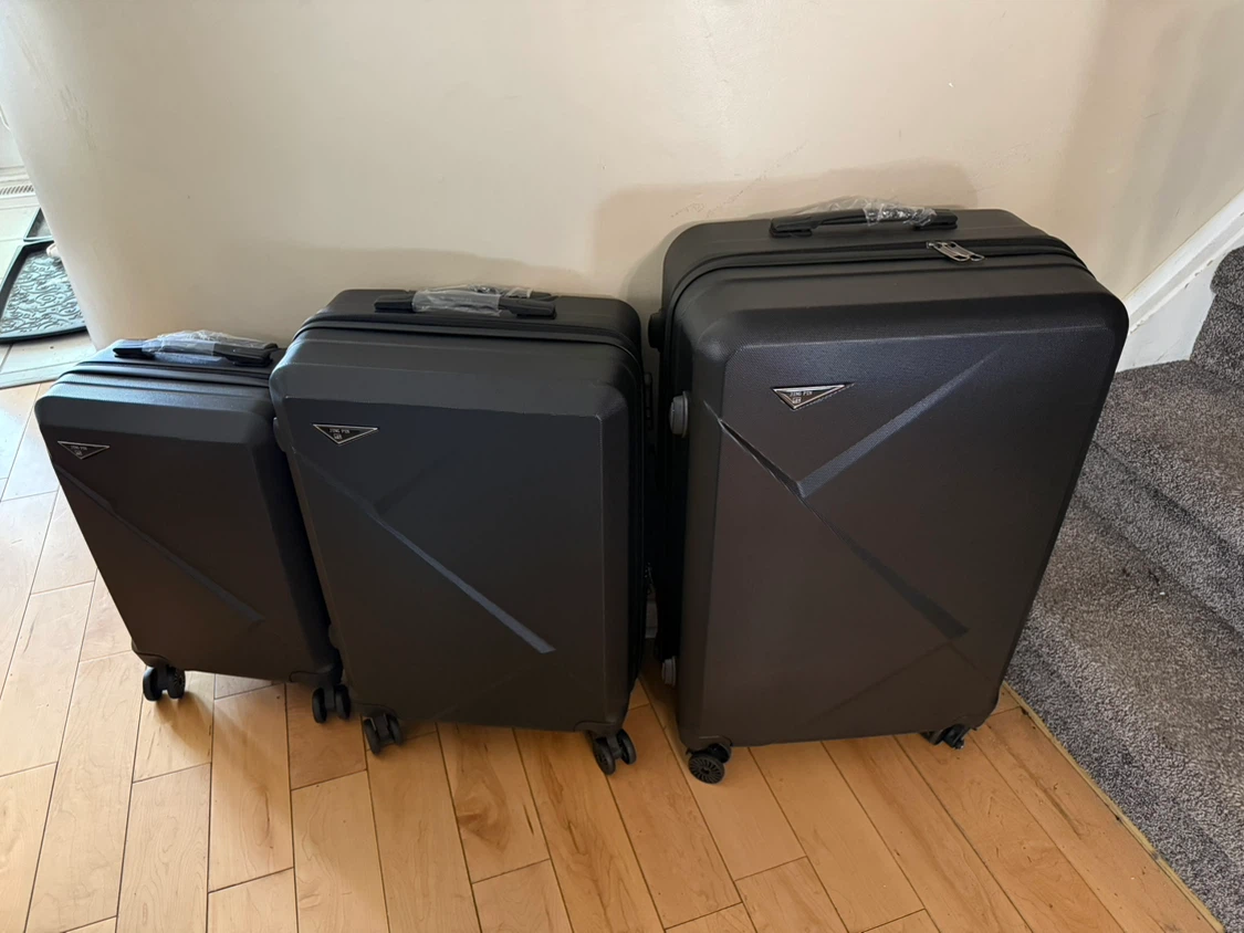 Black Luggage Set one wheel has a piece missing but still works