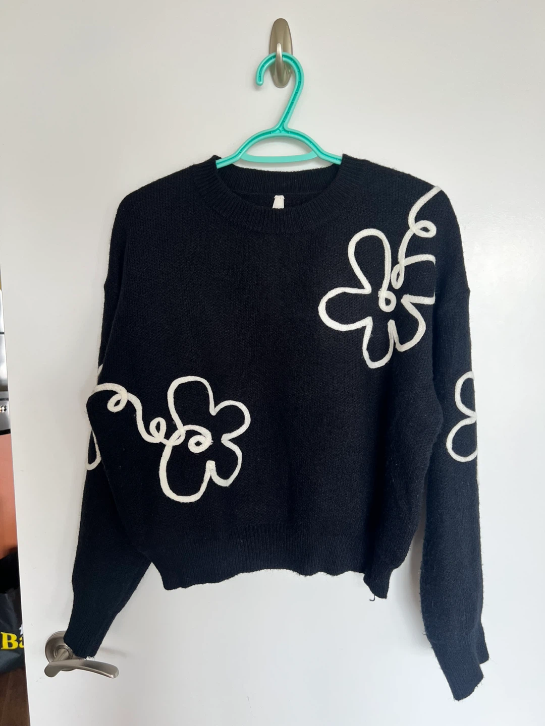 Black sweater with flower design