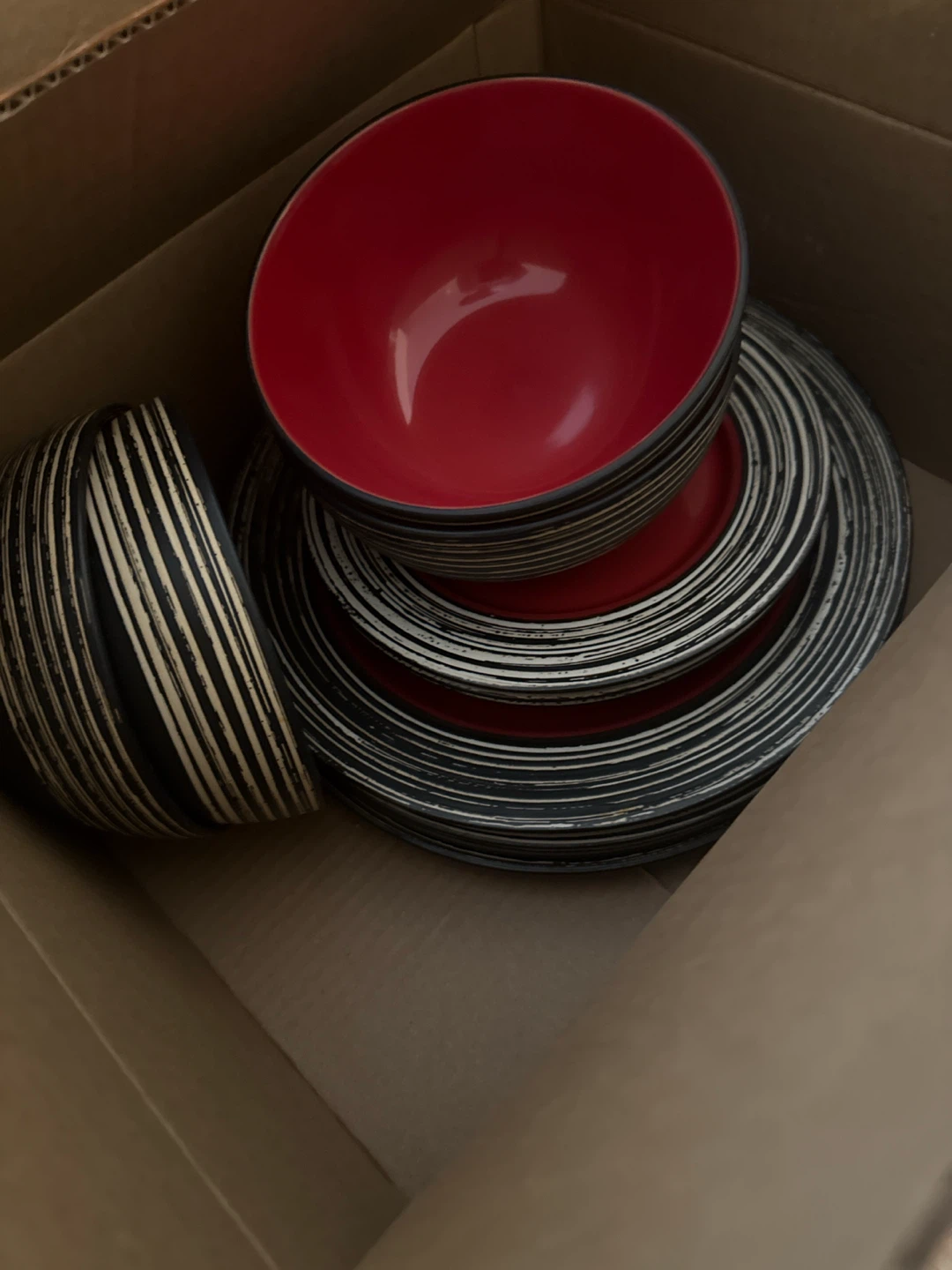 Set of Red and Black Swirl Bowls and Plates