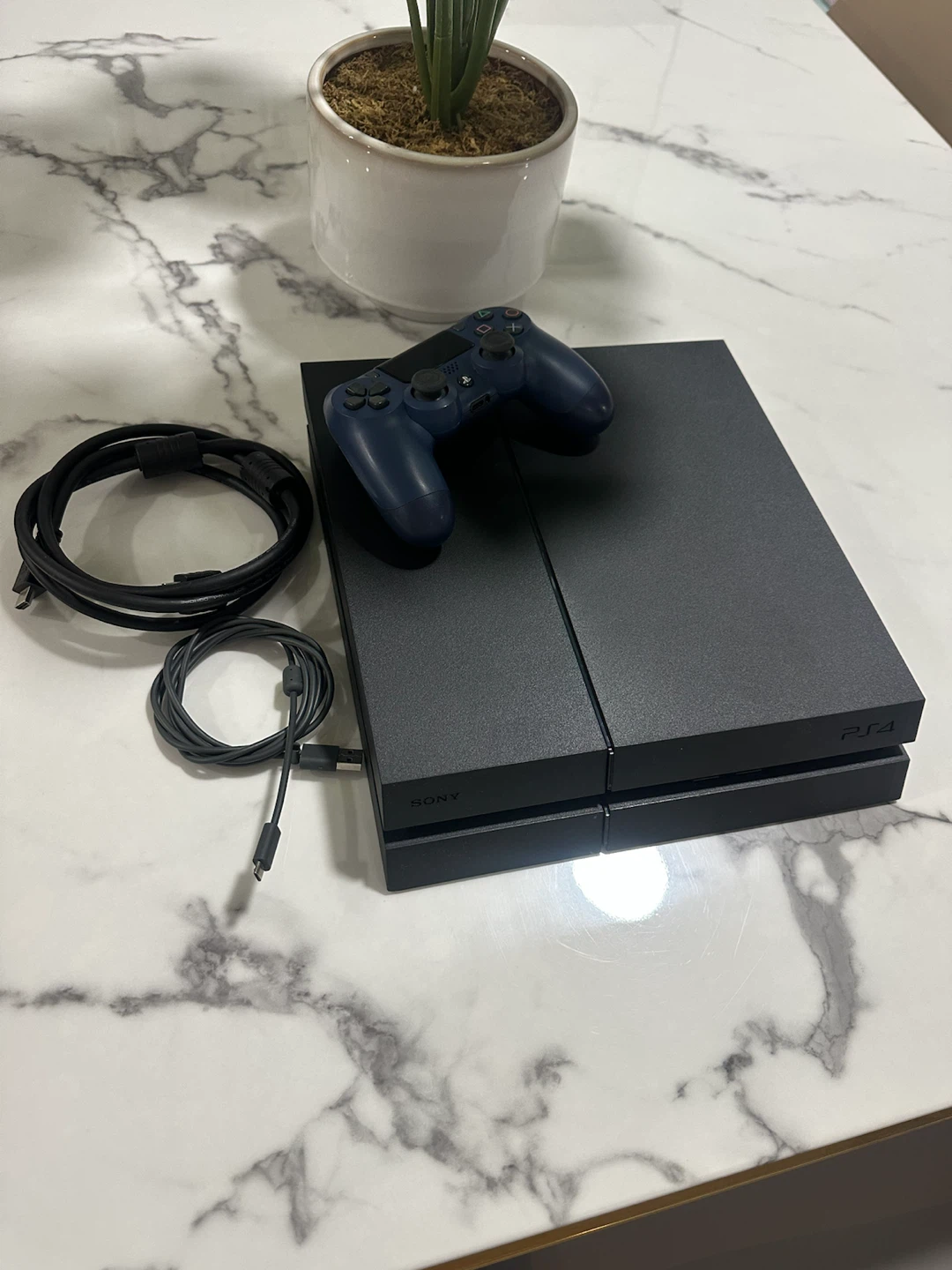 PlayStation 4 in like-new, mint condition. No scratches or dent.