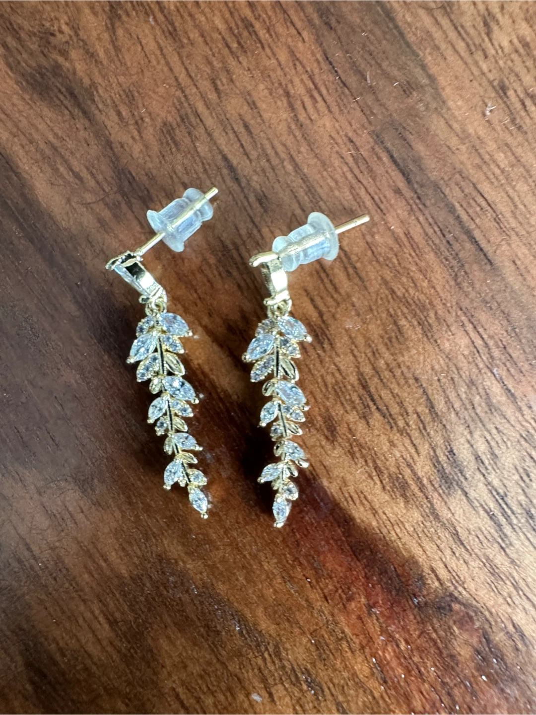 Gold vine drop earrings with clear stones