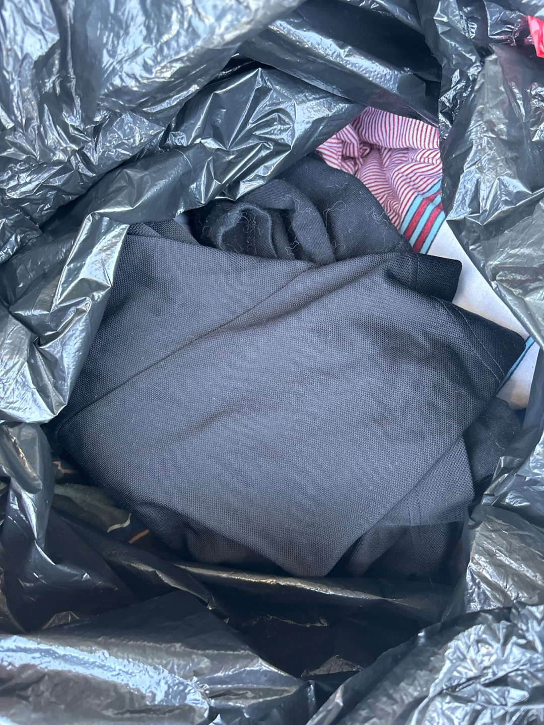 Bag of men’s clothes size large to x large