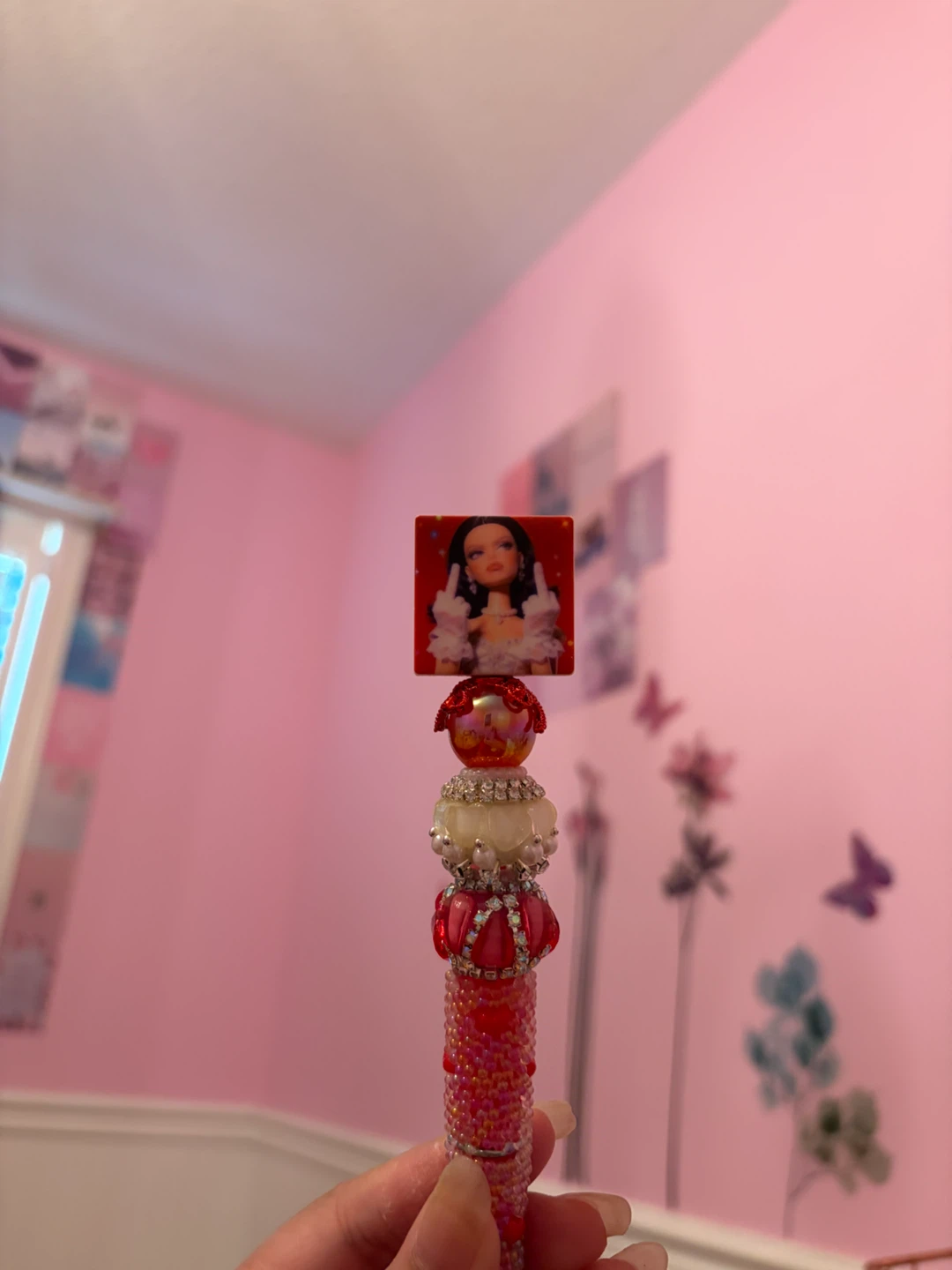 Pink beaded pen with graphic character charm