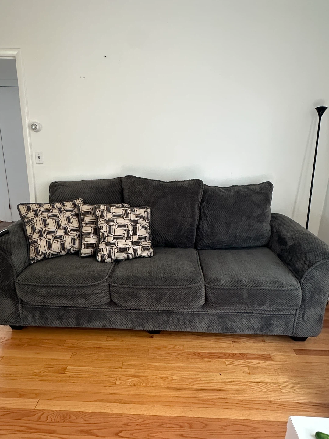 Dark gray three-seater sofa