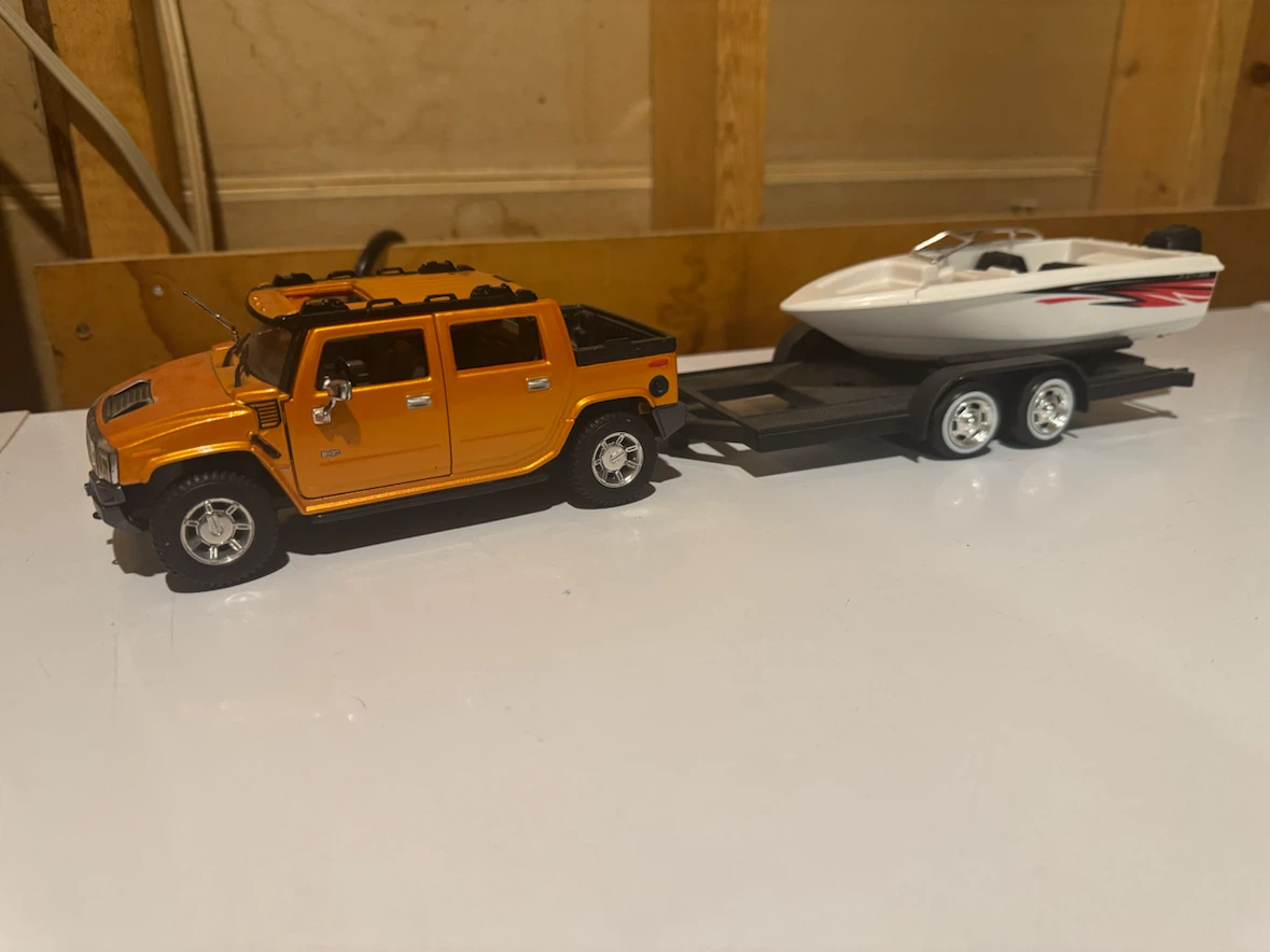 Diecast Hummer with Boat and Trailer.