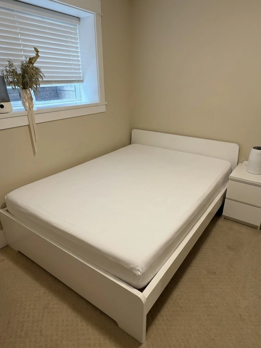 White IKEA MALM queen bed frame and queen memory form mattress