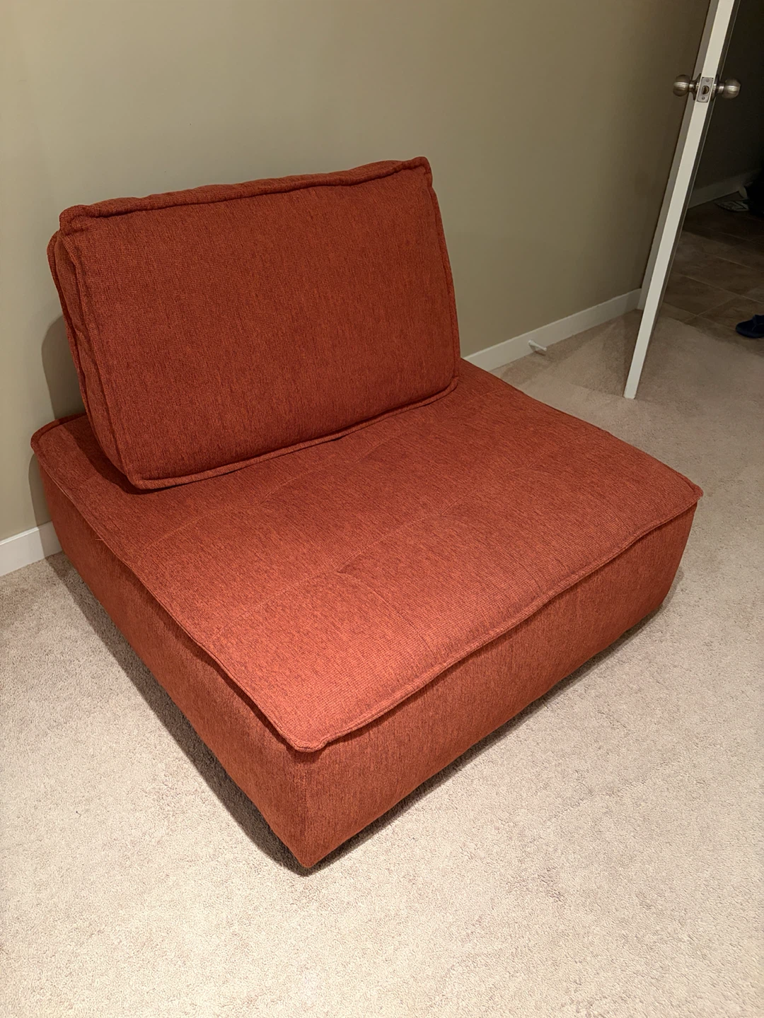 Armless rust orange accent chair