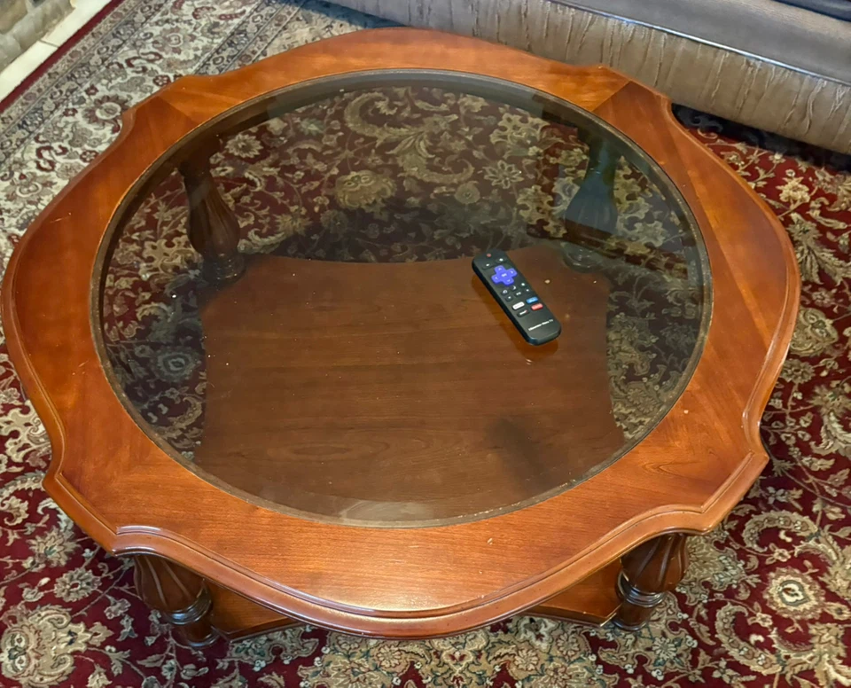 Wooden coffee table with glass top