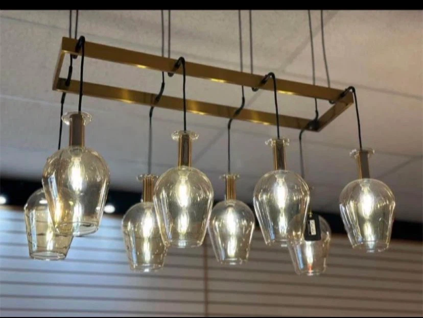Gold rectangular chandelier with eight wine bottle pendants
