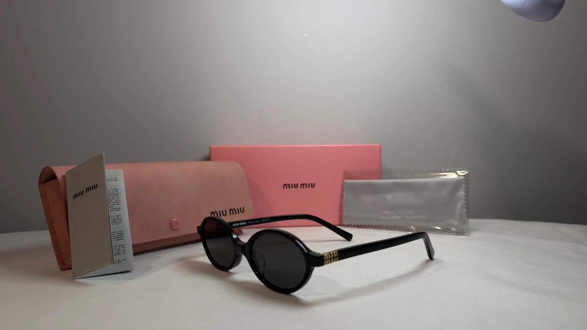 Miu Miu Oval Sunglasses