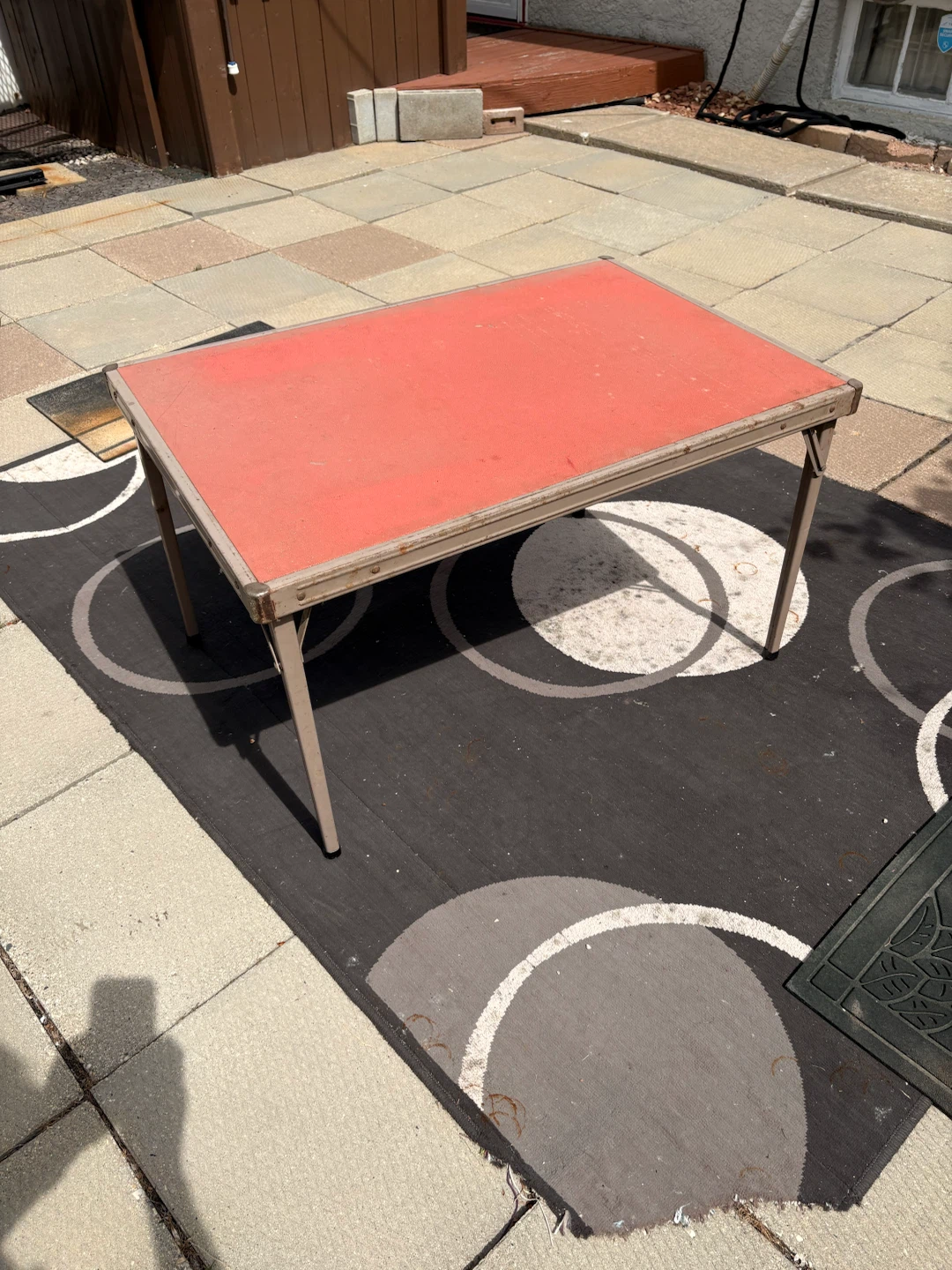 Red folding children ‘s table with metal legs