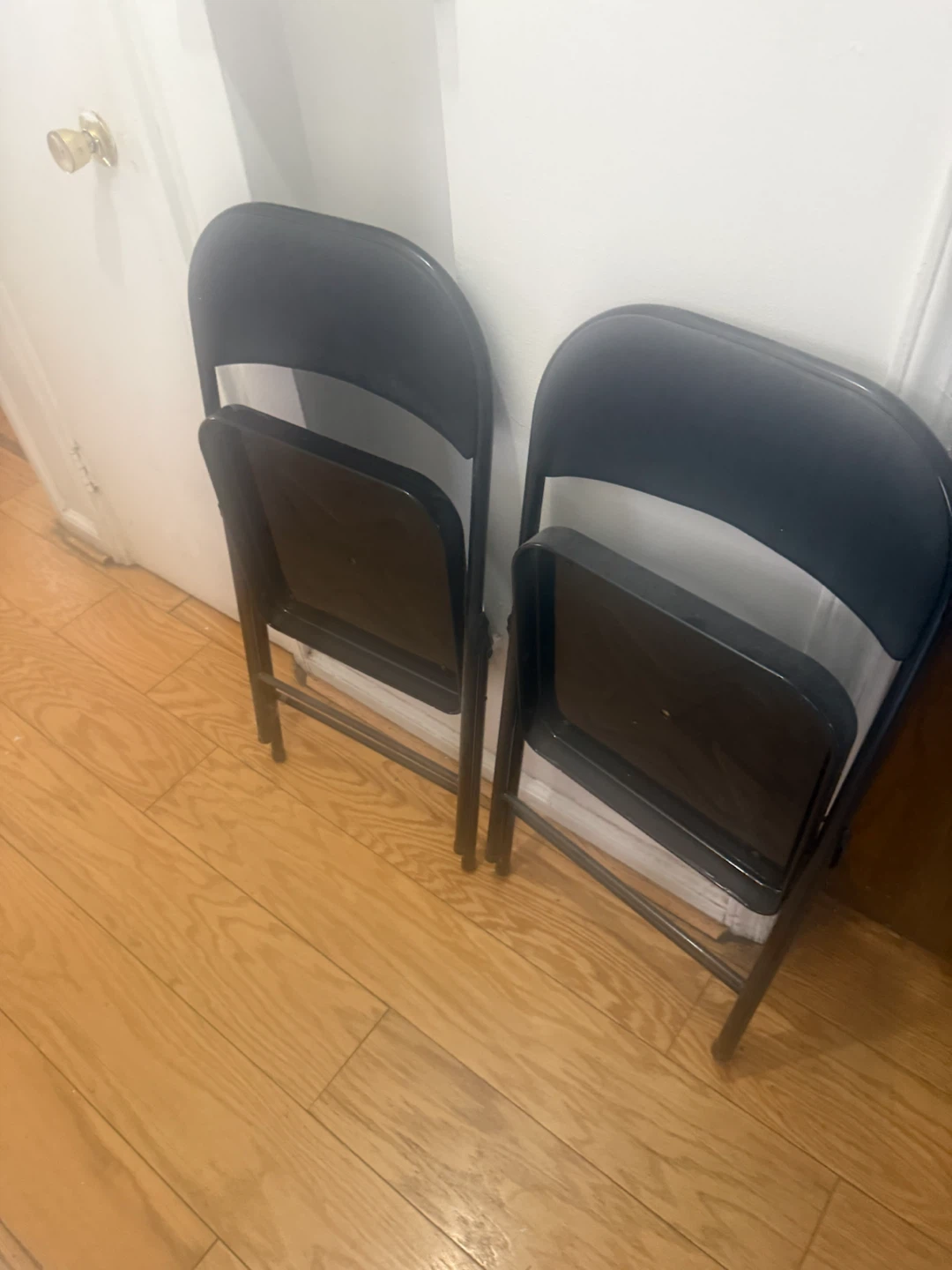 Two Black Folding Chairs