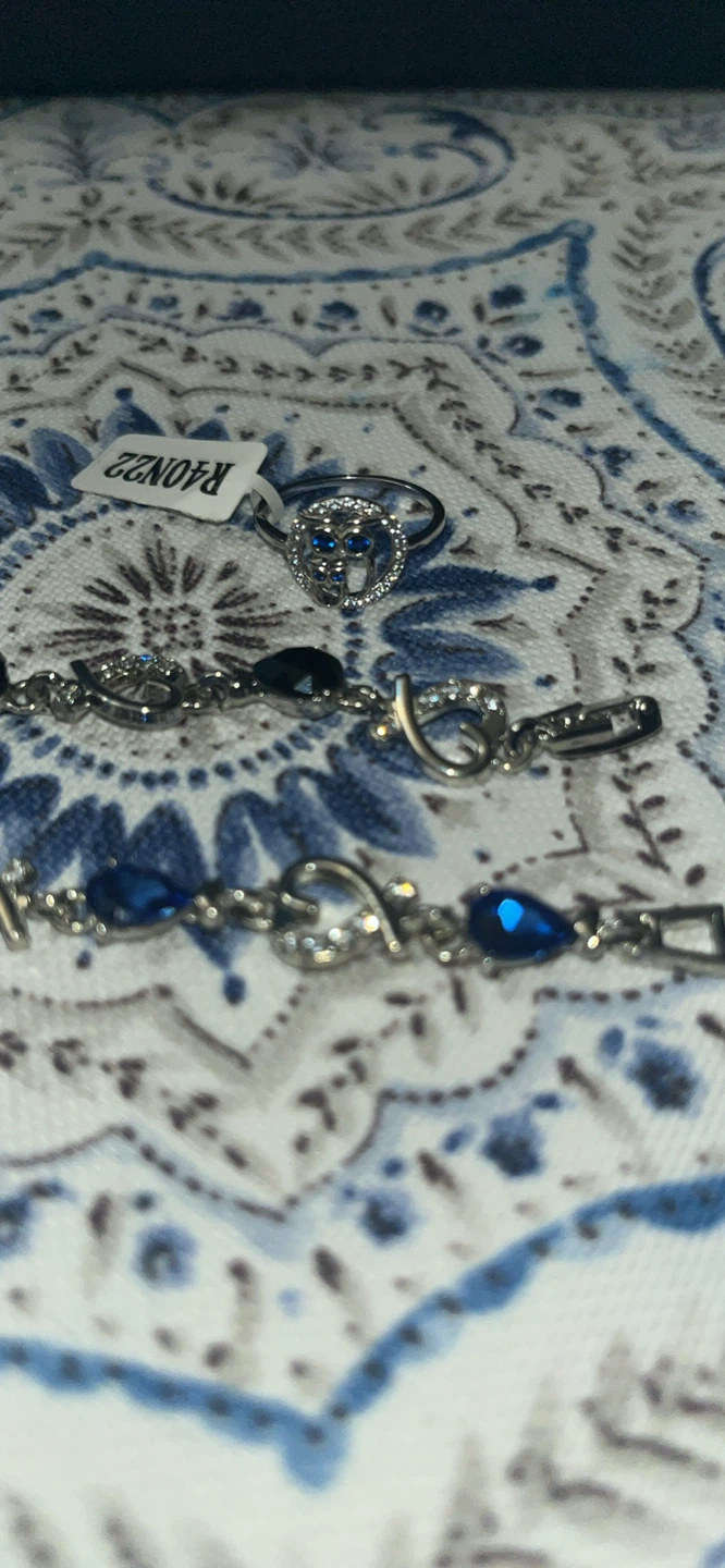 Silver-tone bracelets with blue and black heart-shaped stones - photo 2