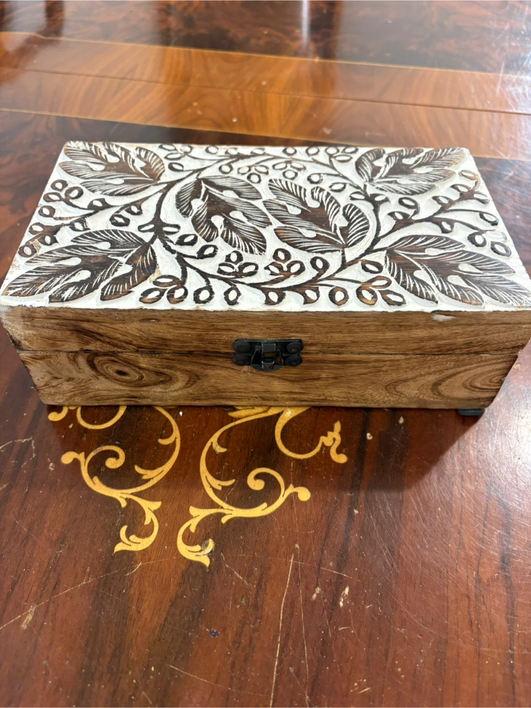 Hand carved wooden storage box with floral lid
