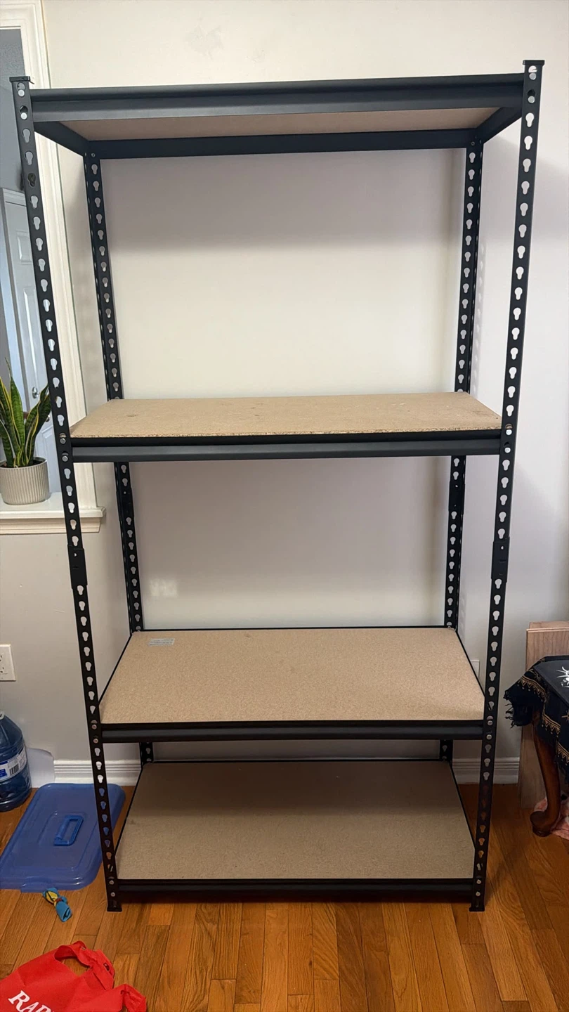 Black metal shelving unit with 4 tiers