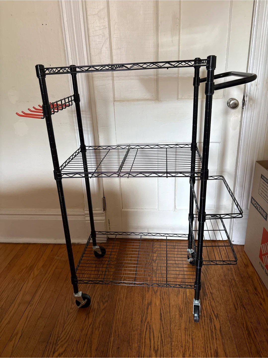 Black metal rolling utility shelf (exercise equipment etc)