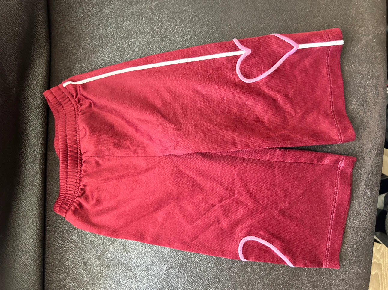 Red Athletic Shorts with White and Pink Stripe Detail