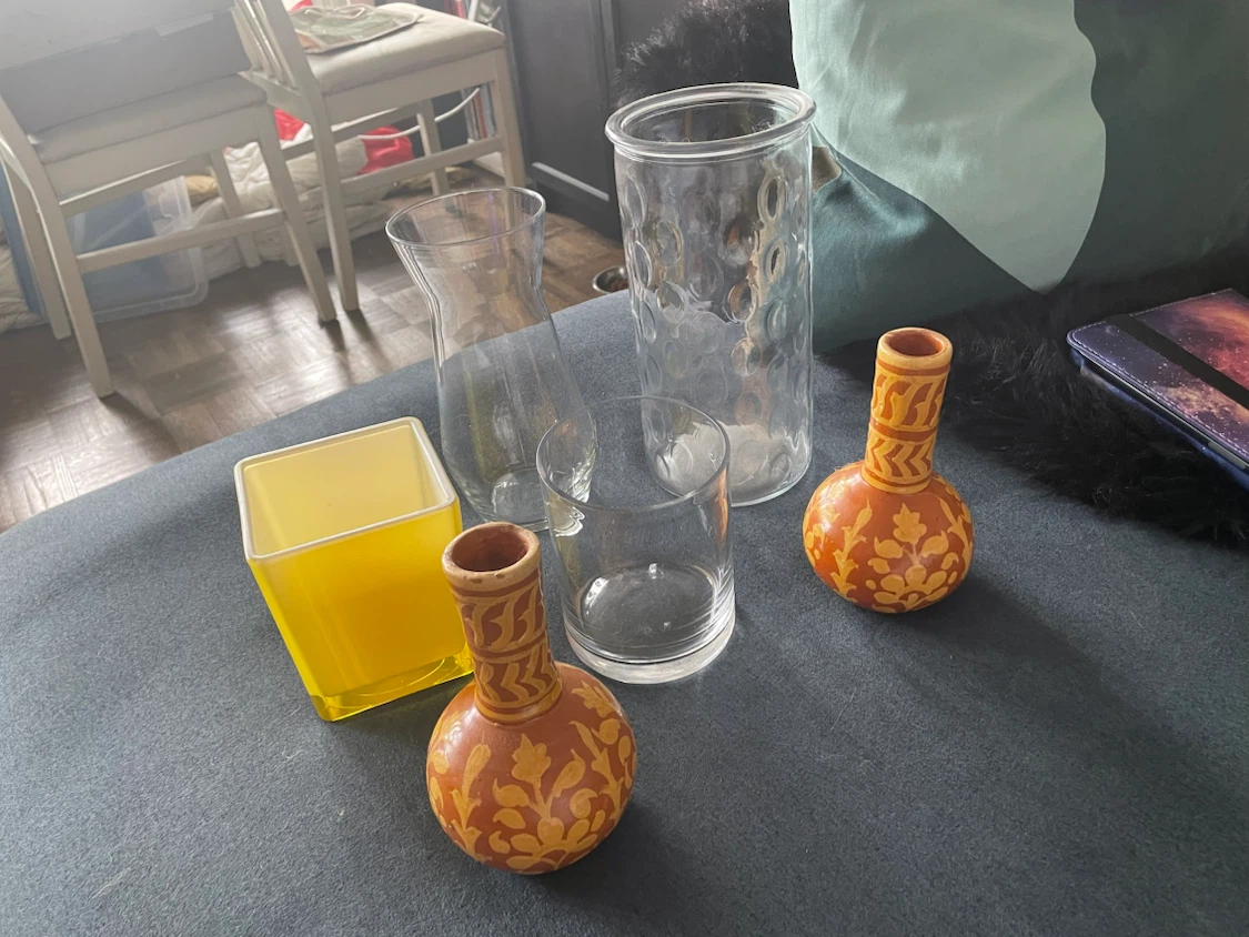Assorted decorative vases and glass container