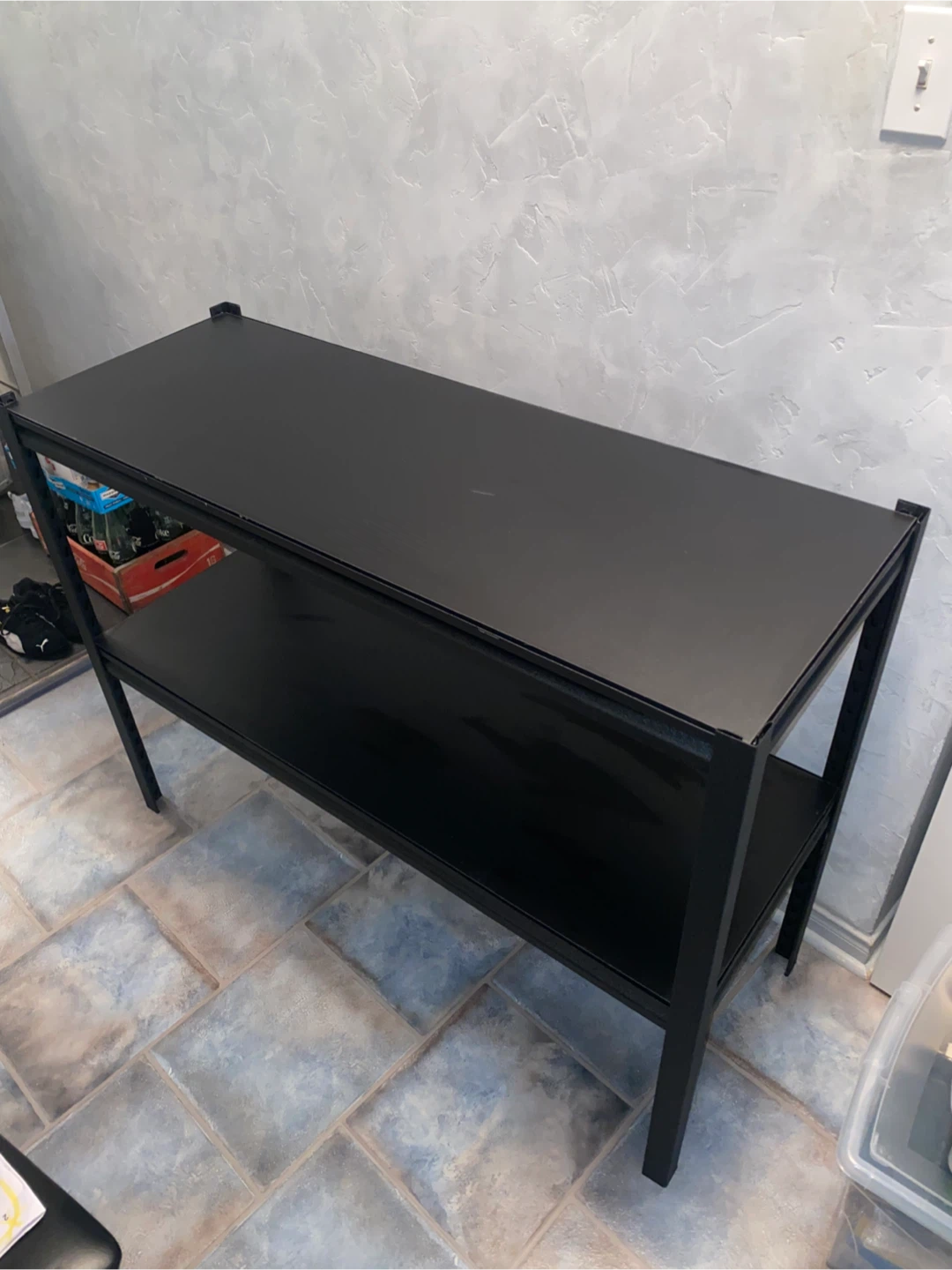 Black two-tier metal shelving unit