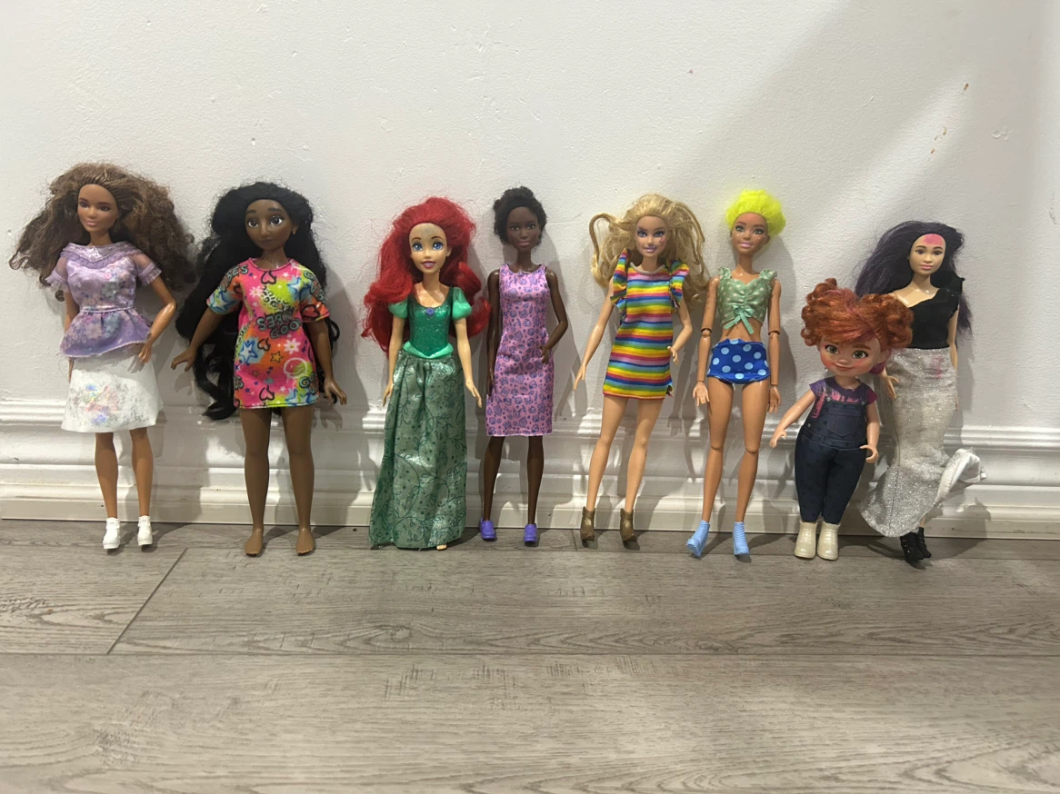 Lot of 8 Fashion Dolls with Assorted Outfits