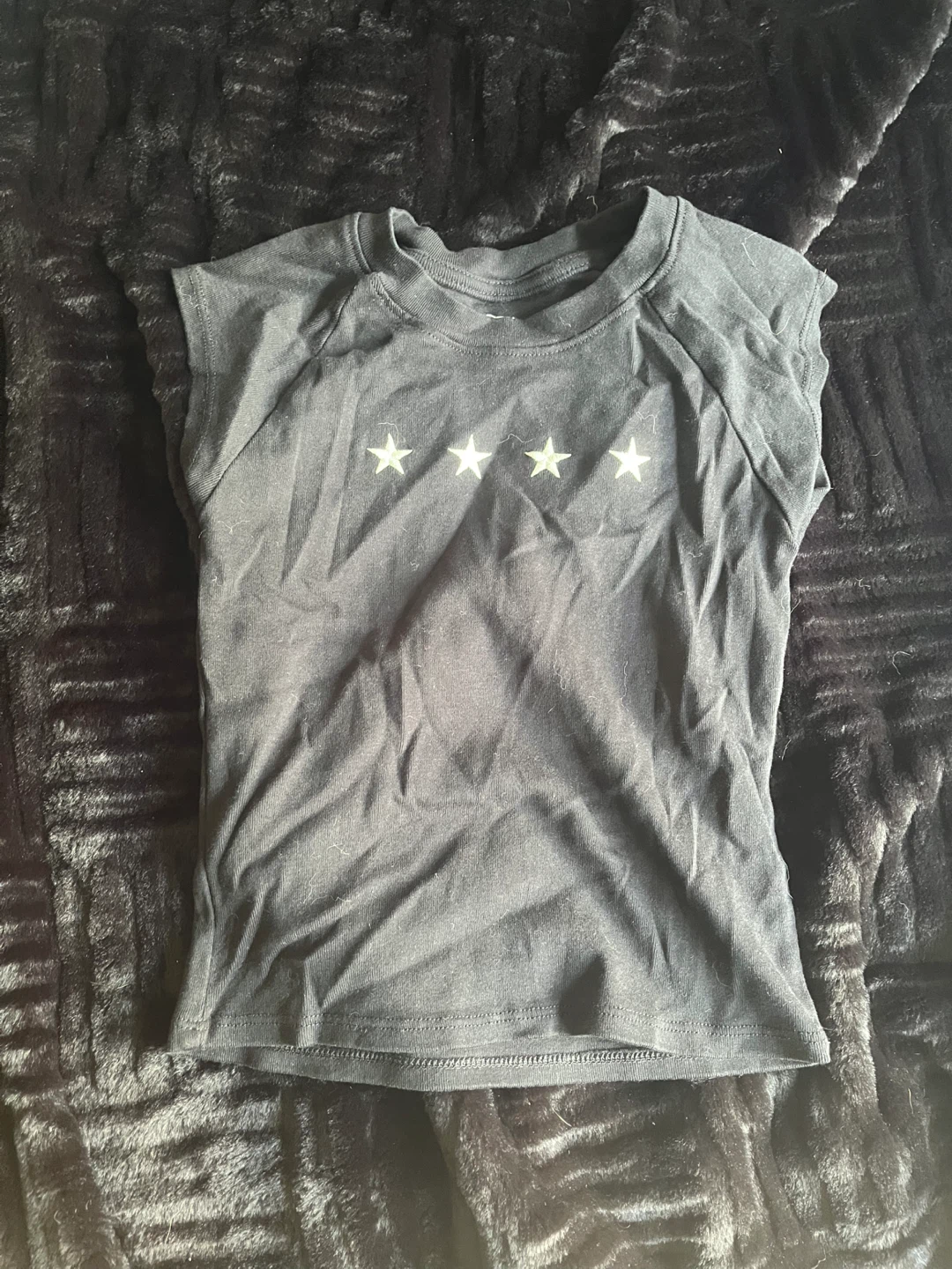 Black sleeveless star graphic t-shirt