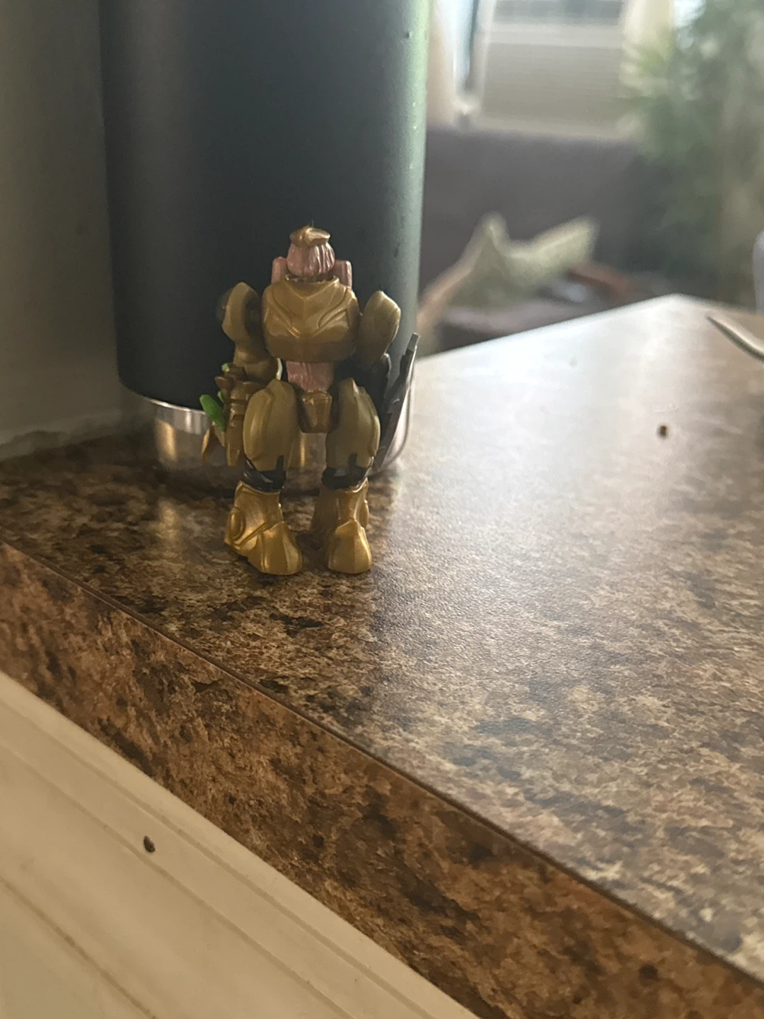 Gold Colored Action Figure Toy