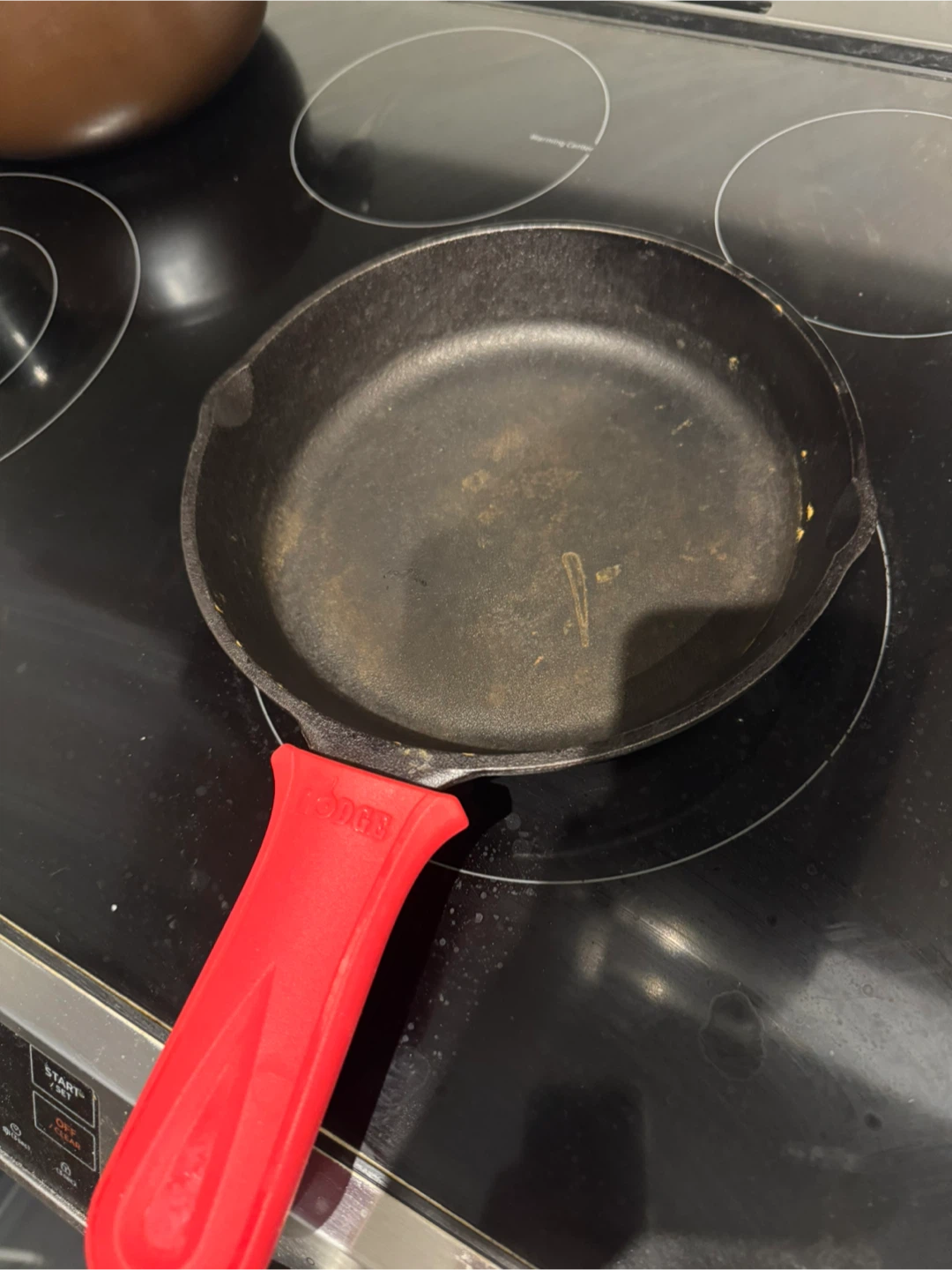 Lodge Cast Iron Skillet with Red Handle
