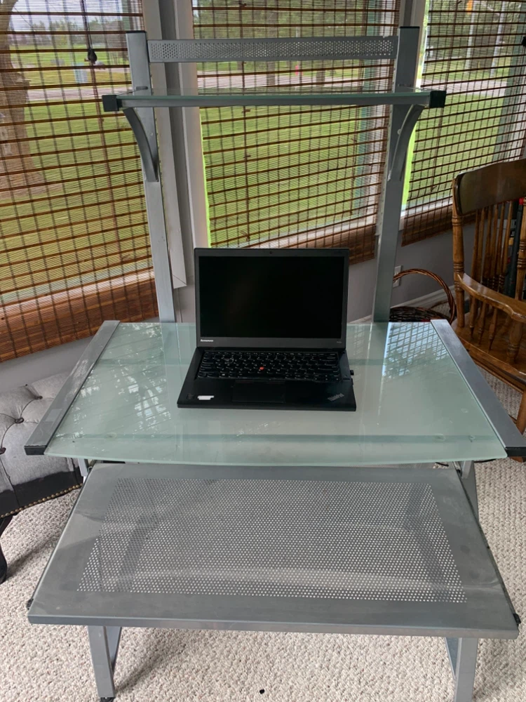 Desk with glass top and shelf