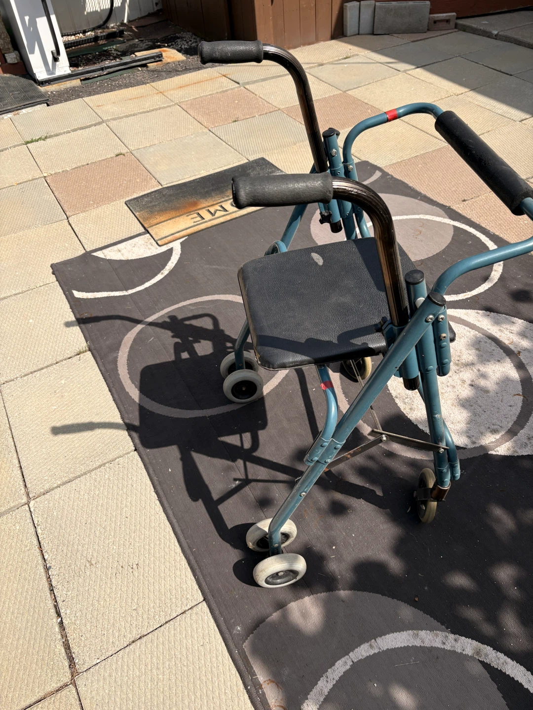 Blue folding walker with seat